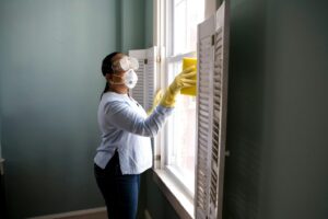 a person cleaning a window
