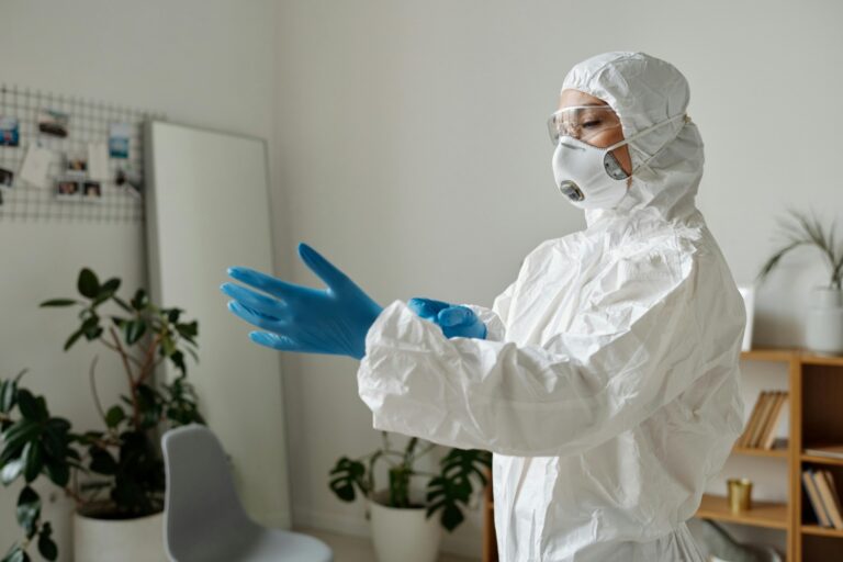 a person wearing a protective suit for extermination