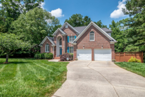 A modern suburban home with a well-maintained lawn